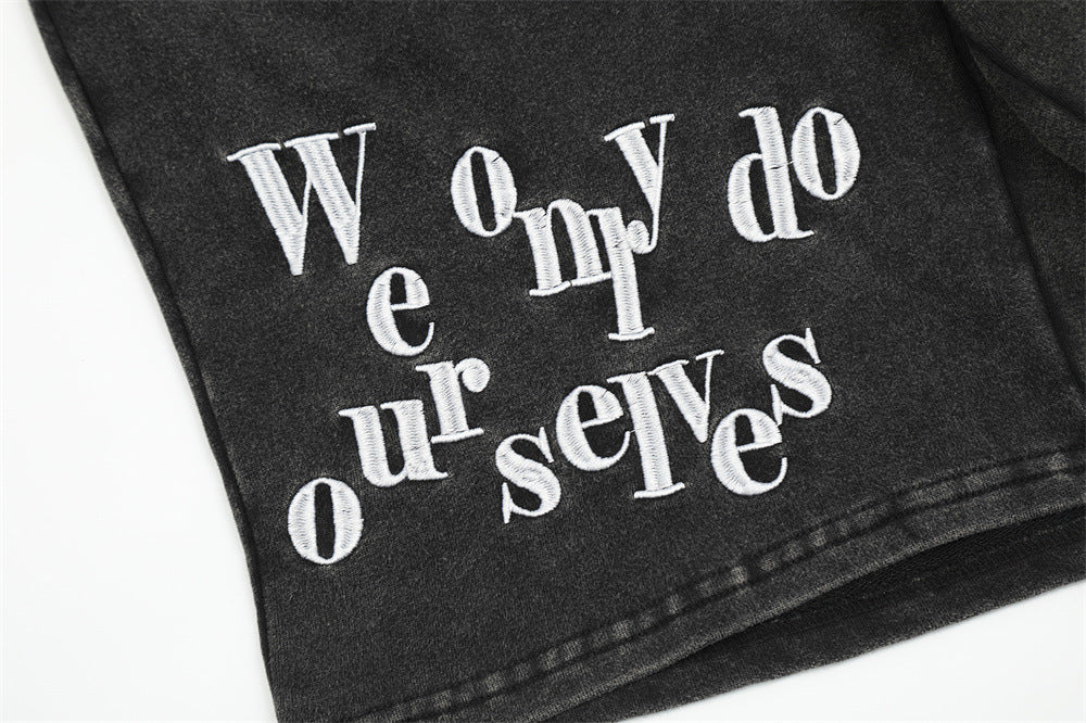Stylish black shorts for men featuring unique embroidery detail for a modern look