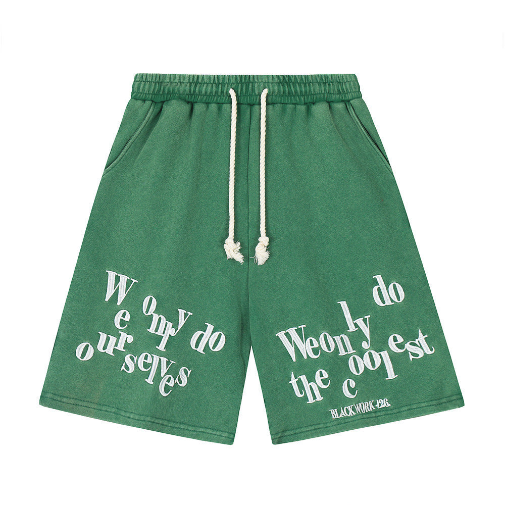 Stylish black shorts for men featuring a unique graphic design and relaxed fit