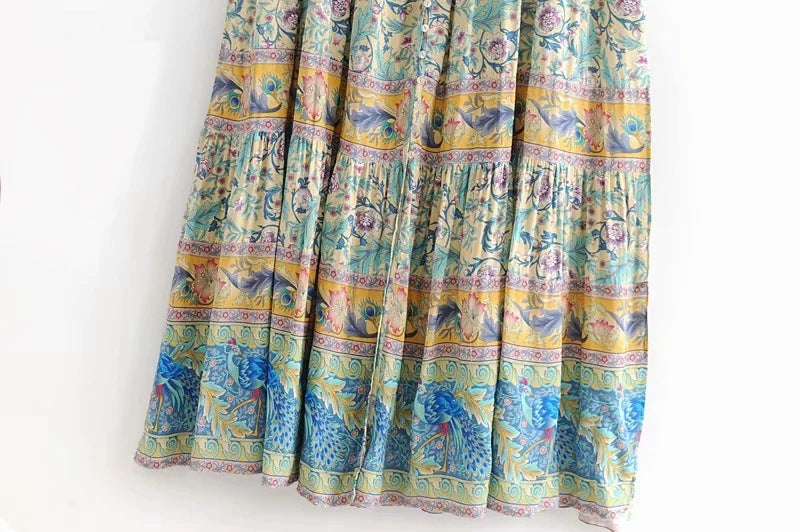 Colorful MONO//FIT bohemian beach dresses with intricate floral patterns and flowing fabric