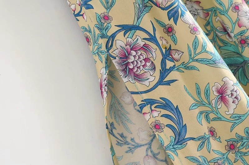 Close-up of floral print on MONO//FIT bohemian beach dresses with vibrant colors and design details