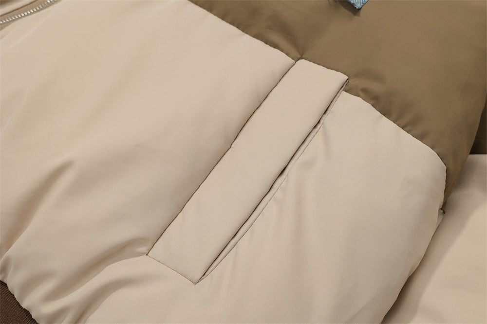 Close-up of a color contrast men's jacket with beige and olive panels for stylish layering