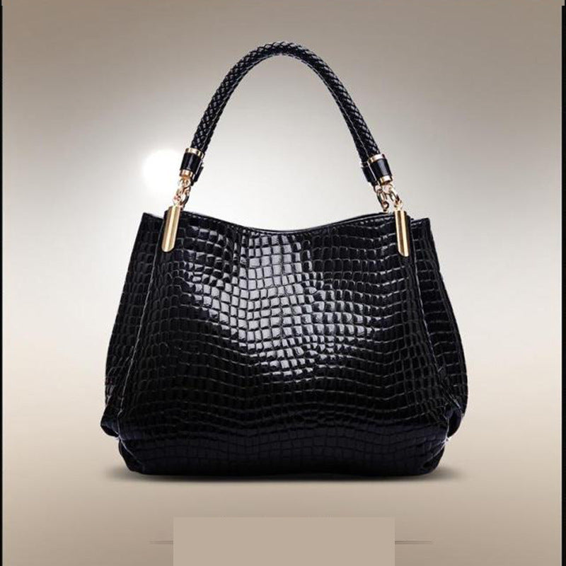 MONO//FIT crocodile pattern bag in black with a stylish design and sturdy handles