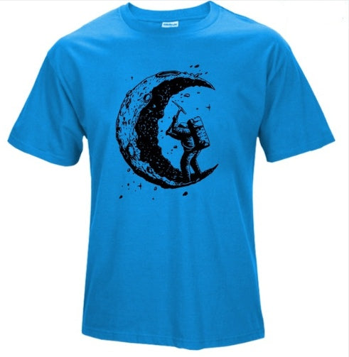 Bright blue digging the moon graphic tee featuring an astronaut with a pickaxe and a crescent moon design