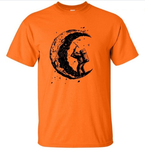 Orange MONO//FIT digging the moon graphic tee featuring an astronaut with a pickaxe