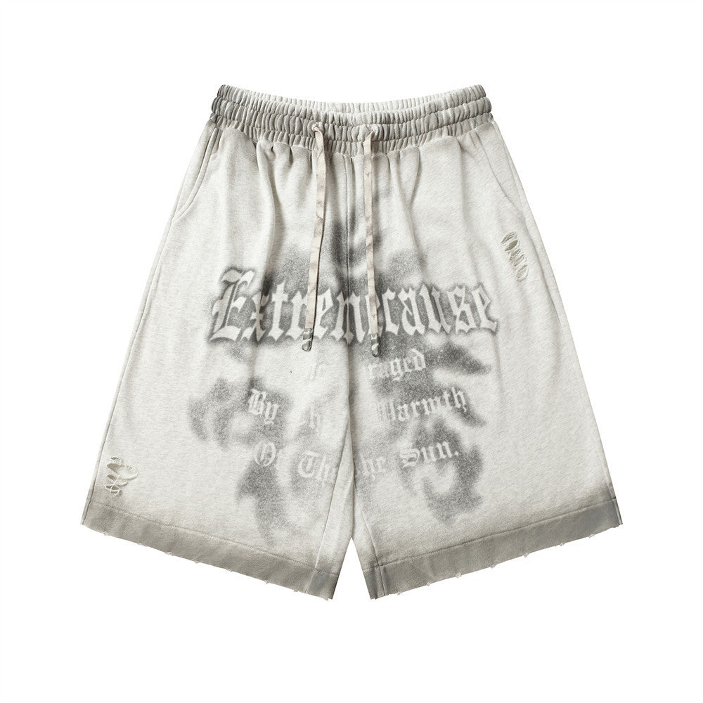 MONO//FIT spray paint style shorts featuring a comfortable elastic waistband and unique graphic design