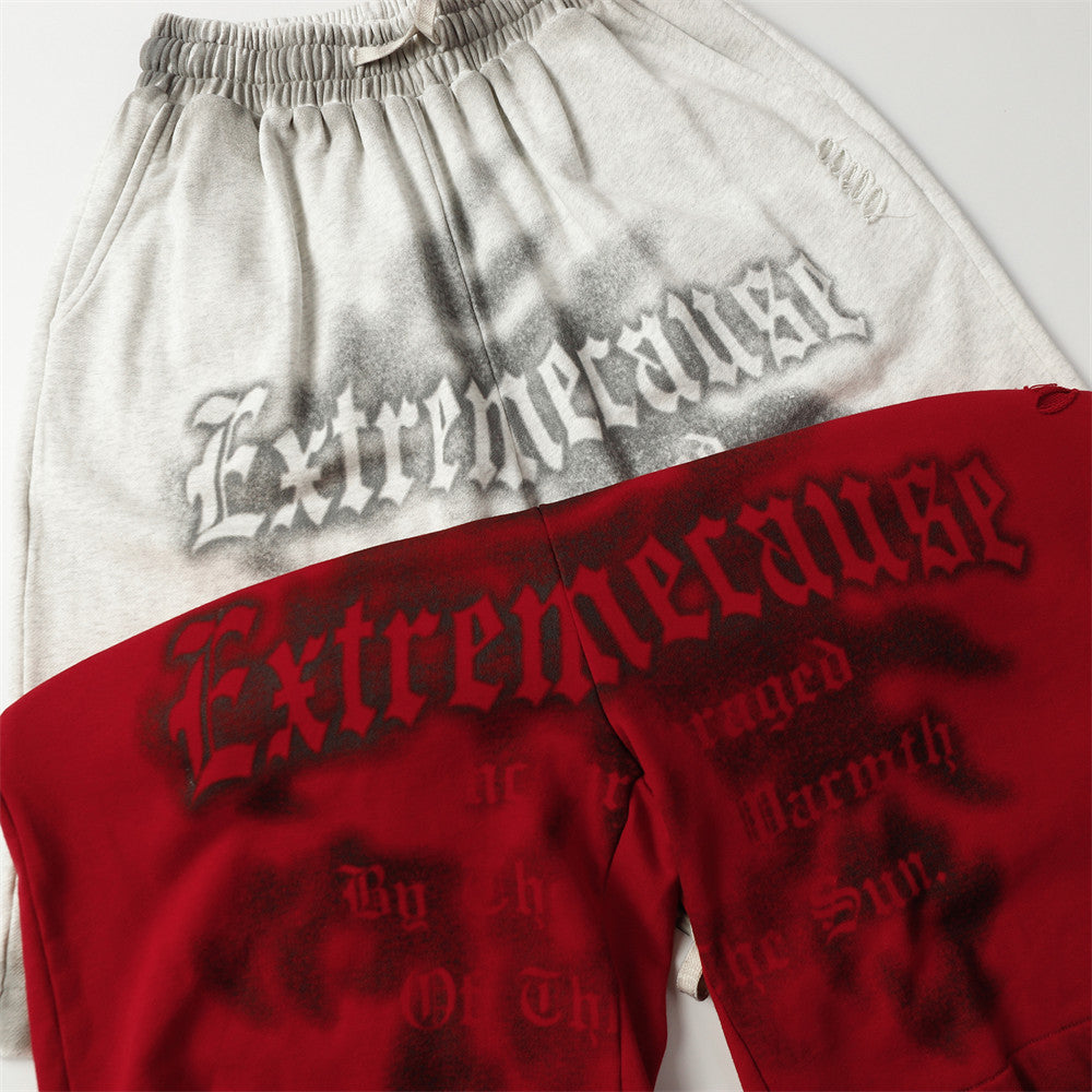 MONO//FIT spray paint style shorts with a unique gray and red design featuring striking graphics