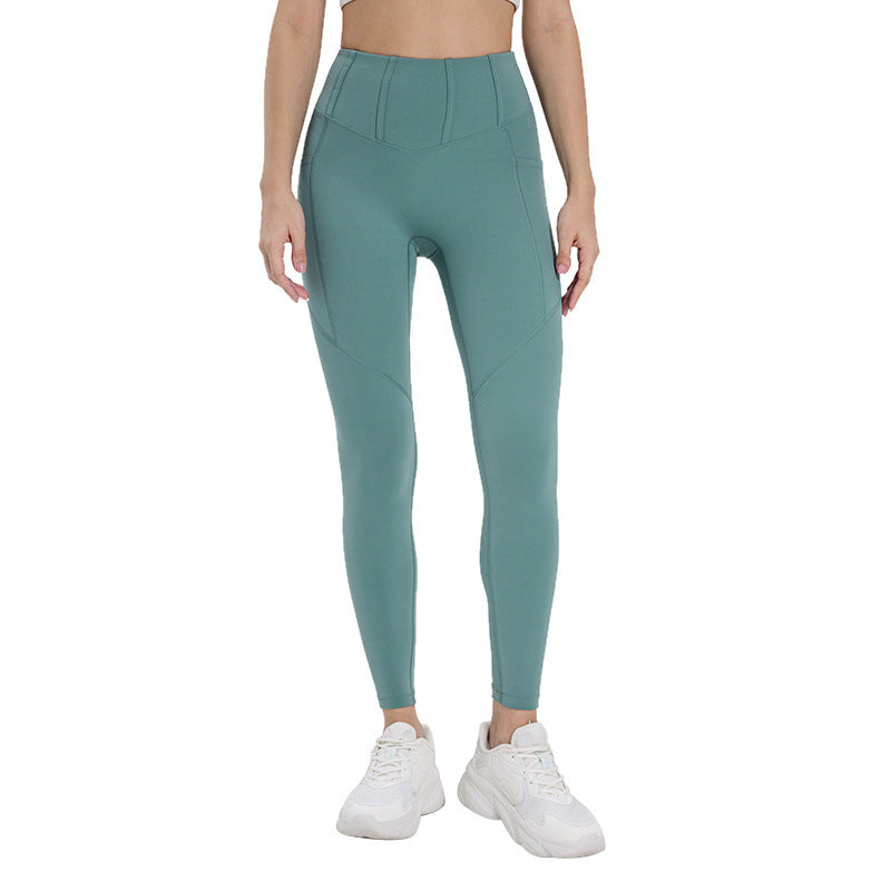 High-waisted women's fitness tights in teal with a sleek design for comfortable workouts