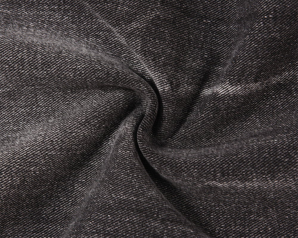 Close-up of MONO//FIT men's distressed wide-leg jeans showcasing the fabric texture and unique distressing details
