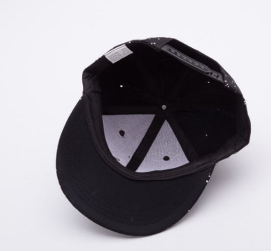 Inside view of a MONO//FIT adjustable skull cap for men in black with white specks