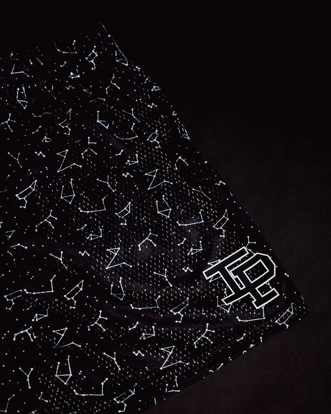 MONO//FIT American basketball shorts in black with star-pattern design for stylish athletic wear