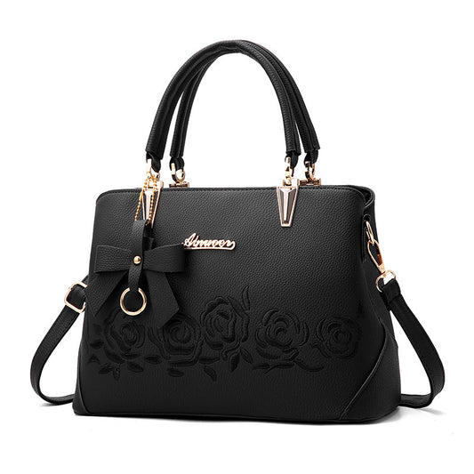 Stylish MONO//FIT fashionable women's handbag with bow detail and floral design
