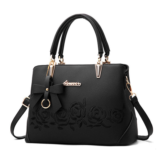Stylish MONO//FIT fashionable women's handbag with bow detail and floral design