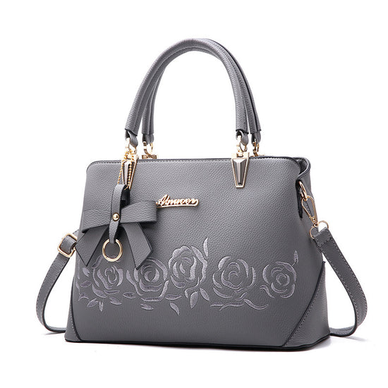 Stylish MONO//FIT fashionable women's handbag in gray with rose design and bow detail