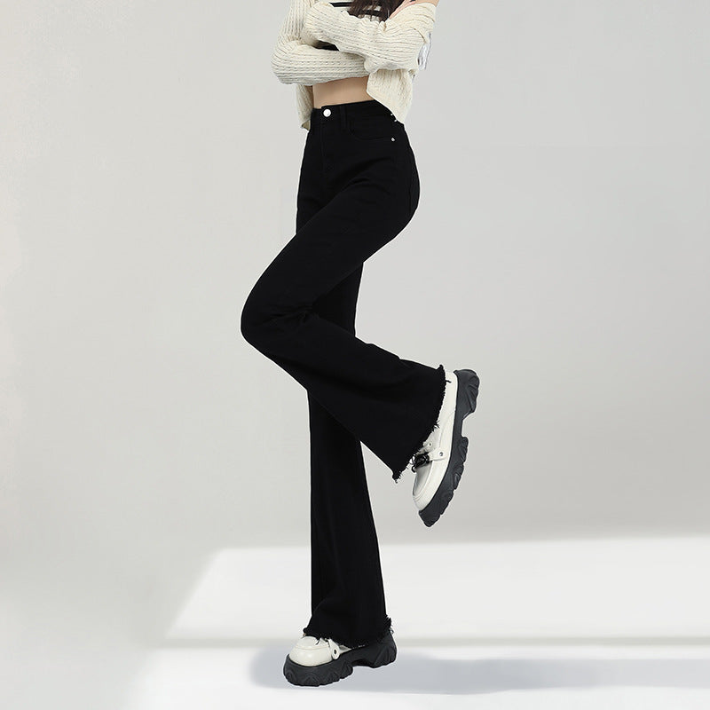 Stylish black weila jeans women with a flared cut, paired with a trendy top and casual footwear
