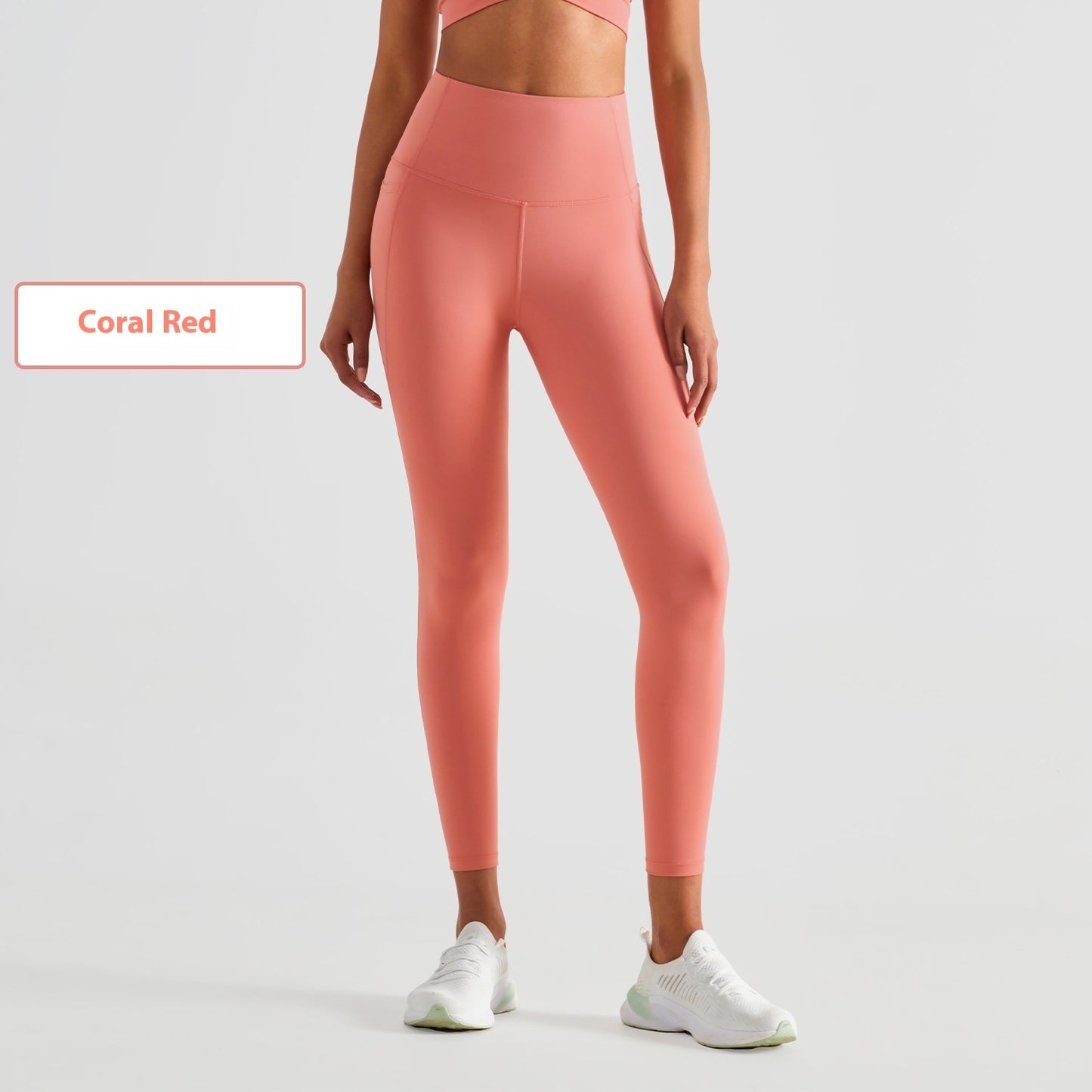 Stylish coral red tights for women's fitness, perfect for workouts and active wear