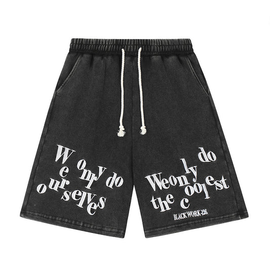 Stylish black shorts for men with unique typography design and adjustable drawstring waistband