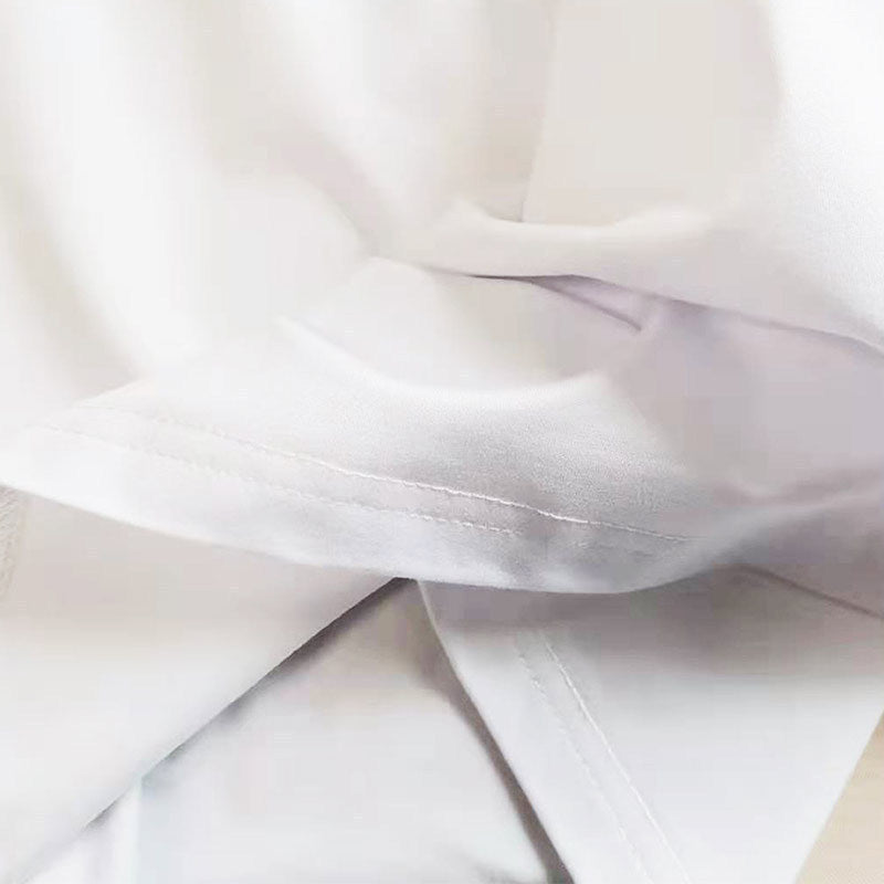 Close-up of MONO//FIT classic car racing t-shirts showcasing high-quality fabric and stitching details