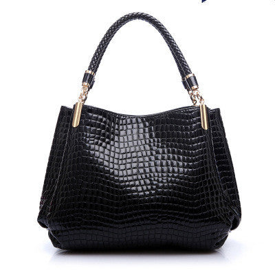 Stylish black handbag with crocodile pattern bag design, featuring elegant handles and spacious interior