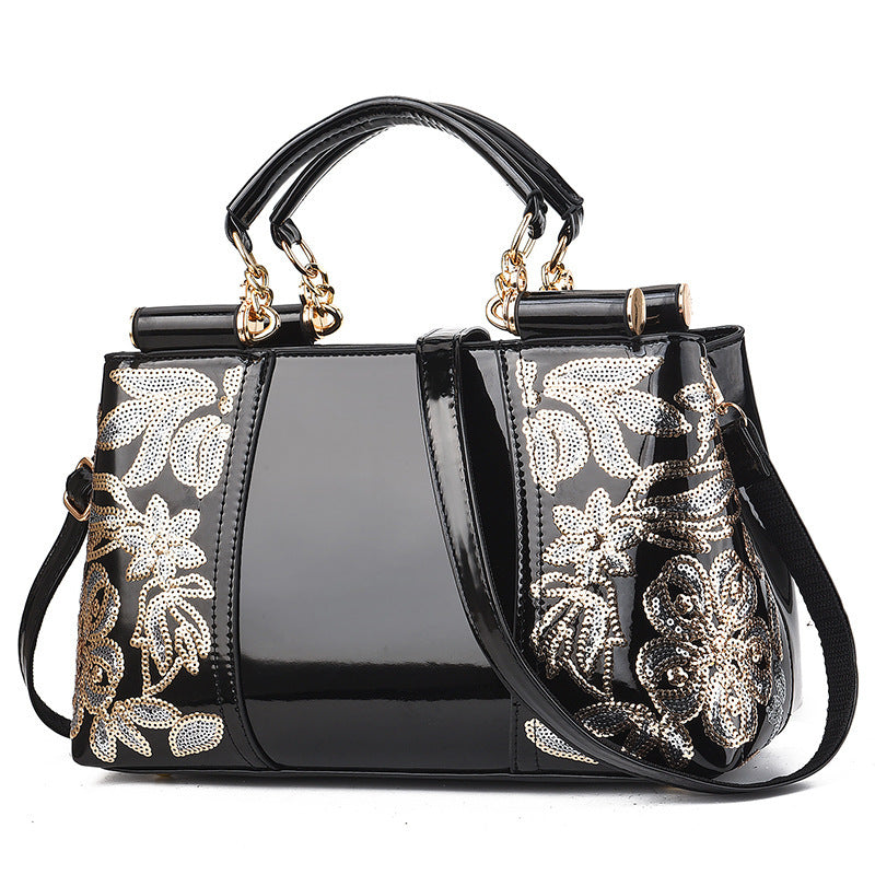 MONO//FIT elegant bridal party bag in black with floral design and dual handles