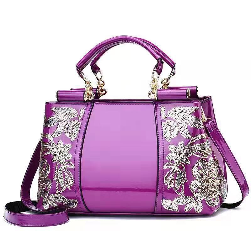 MONO//FIT elegant bridal party bag in shiny purple with floral embellishments and detachable strap