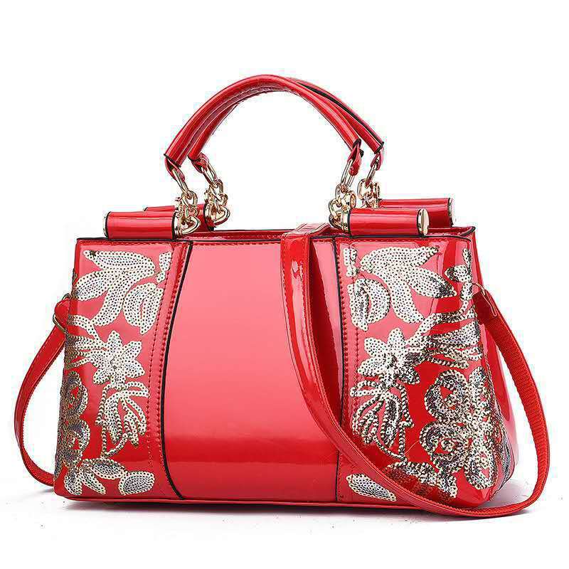 Red MONO//FIT elegant bridal party bag with stylish floral embellishments and dual handles