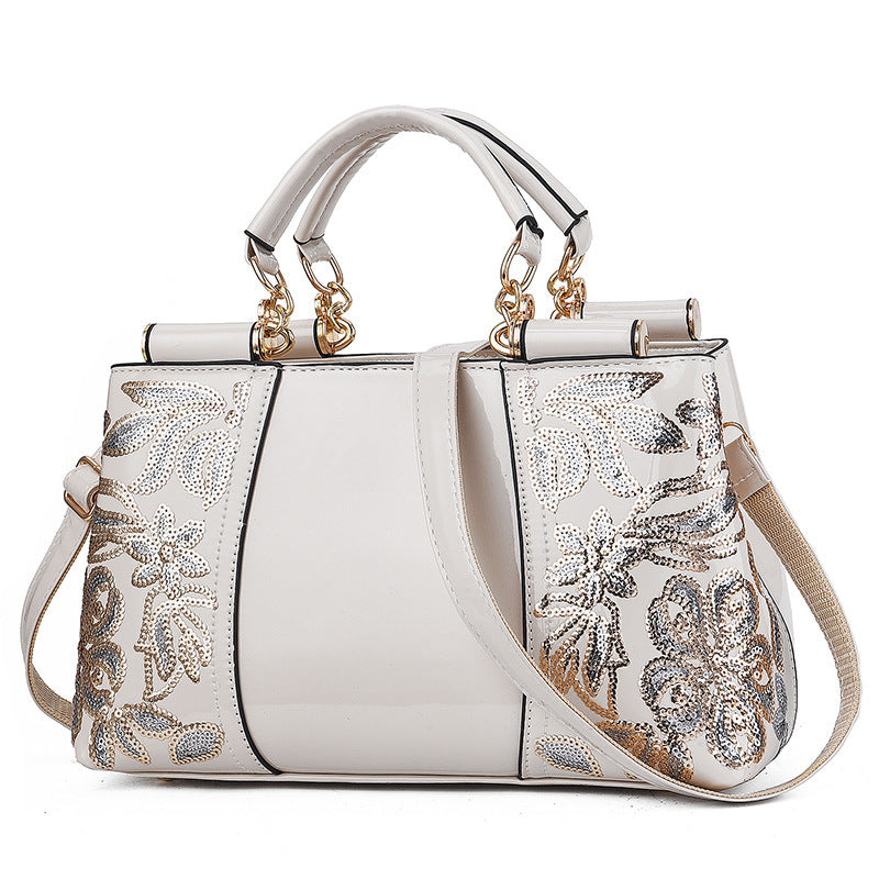 MONO//FIT elegant bridal party bag in white with floral embellishments and dual handles