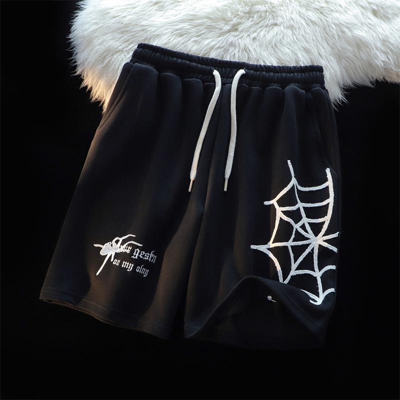 MONO//FIT embroidered spider shorts in black with white spider web design and adjustable drawstring