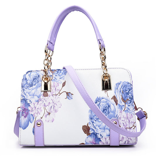 MONO//FIT fashion printed handbag featuring a floral design in blue and purple with dual straps