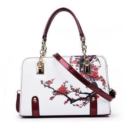 Fashion printed handbag by MONO//FIT with floral design and adjustable shoulder strap