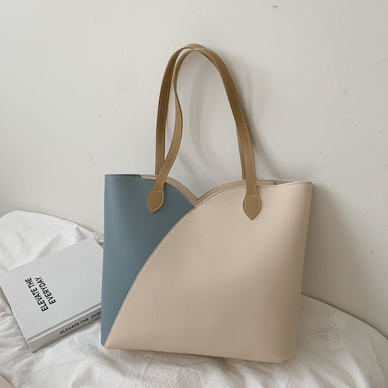 Trendy MONO//FIT two-tone fashion shoulder bag for women with spacious design and sturdy straps
