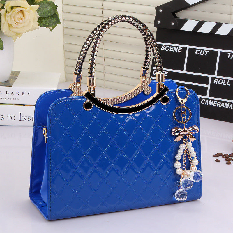 Stylish blue MONO//FIT handbag with decorative charm, perfect fashion shoulder bags for women