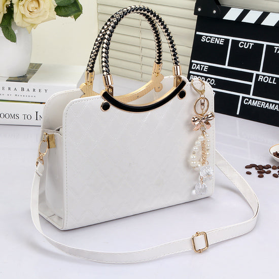 Elegant white MONO//FIT fashion shoulder bags for women with stylish handles and decorative charms