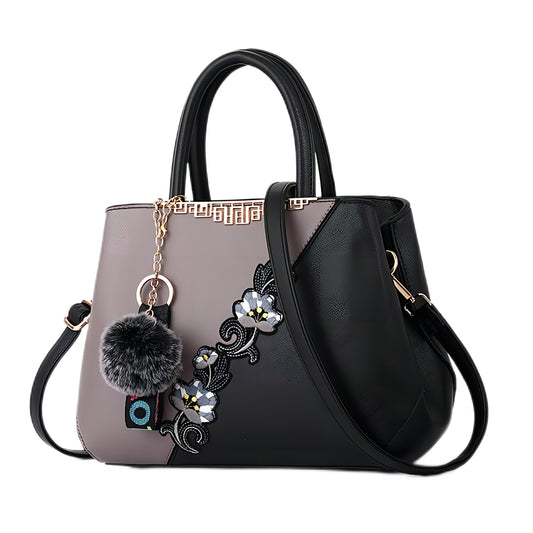 Stylish MONO//FIT handbag featuring floral accents, perfect for fashionable handbags for women.