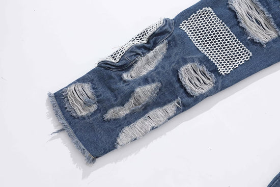 MONO//FIT heavy industry style jeans with distressed patches and mesh detailing for a rugged look