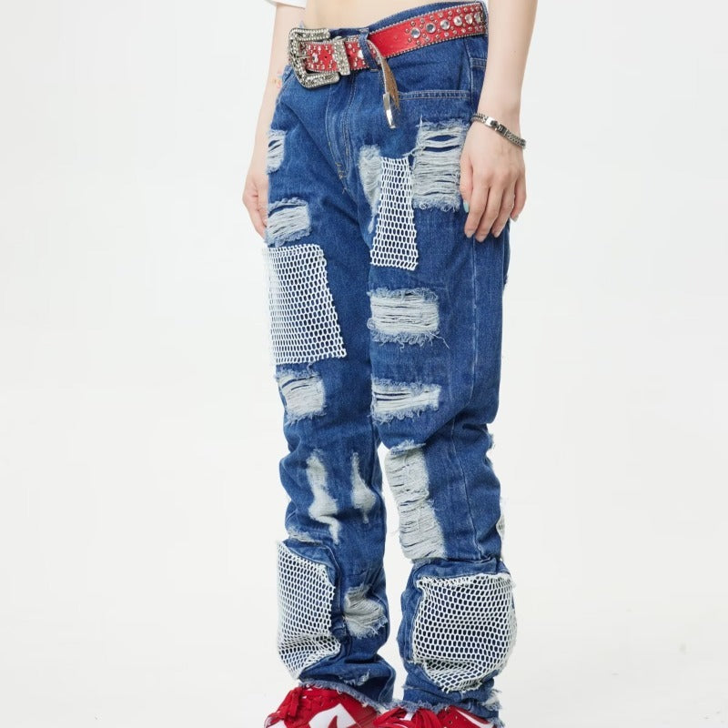 MONO//FIT heavy industry style jeans featuring distressed patches and mesh details for a rugged look