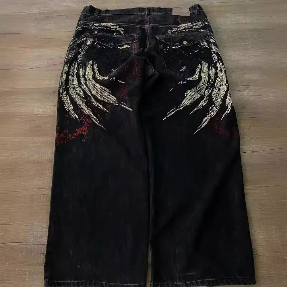 MONO//FIT Hip Hop embroidered jeans with unique wing design and distressed finish on the back