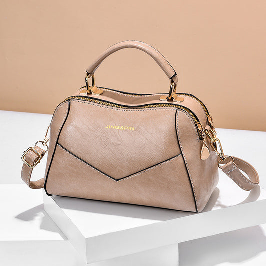 Stylish crossbody handbag in beige with a chic design and gold detailing from MONO//FIT