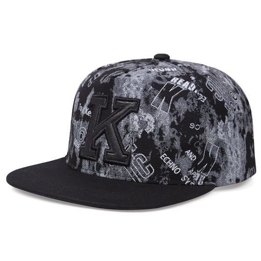 MONO//FIT K letter baseball cap with a textured black and gray design for stylish casual wear