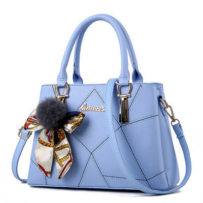 Light blue MONO//FIT Korean fashion handbags with a decorative bow and pompom detail