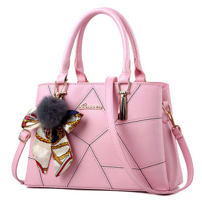 Stylish pink MONO//FIT Korean fashion handbags with a decorative bow and pom-pom accessory