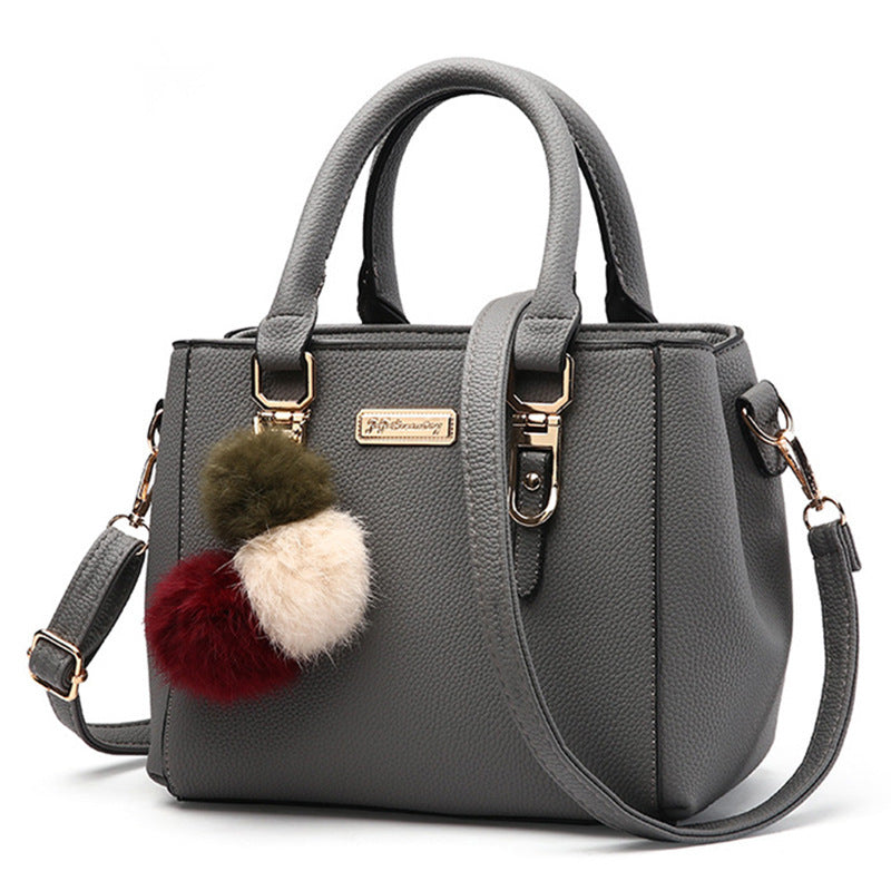 Stylish MONO//FIT Korean one-shoulder bag in gray with a charming pom-pom accessory