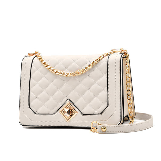 Luxury embroidered shoulder bag in cream with a quilted design and gold chain strap