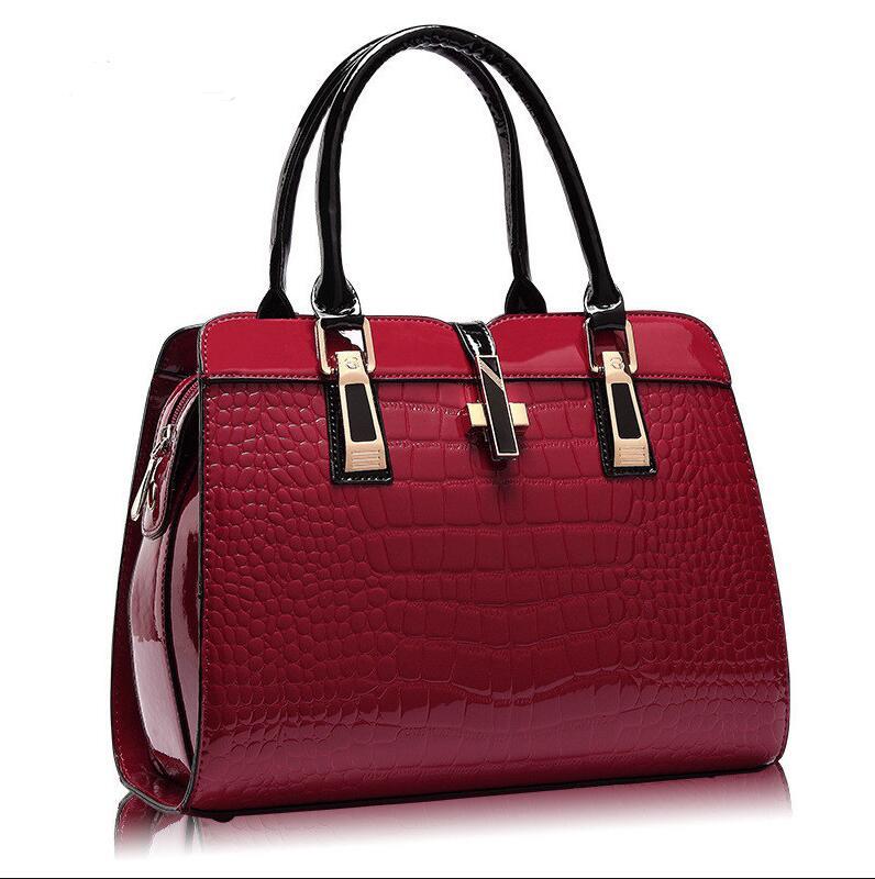 Red MONO//FIT luxury women's handbags with a crocodile texture and elegant handles