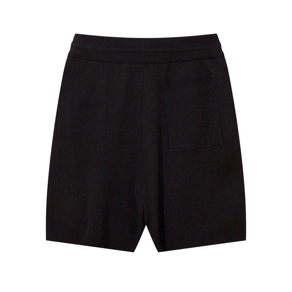 Luxury wool shorts for men in black with a sleek design and back pocket
