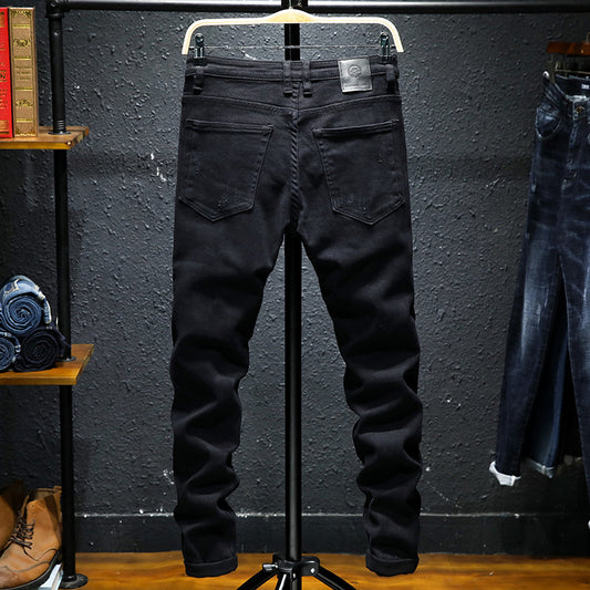 MONO//FIT mens black ripped jeans on a hanger showcasing a stylish back view