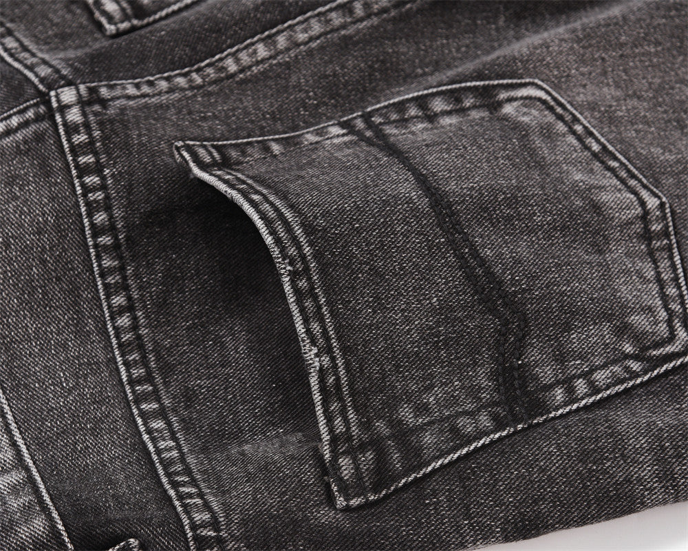 MONO//FIT men's distressed wide-leg jeans featuring a close-up of the pocket detail