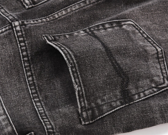 MONO//FIT men's distressed wide-leg jeans featuring a close-up of the pocket detail