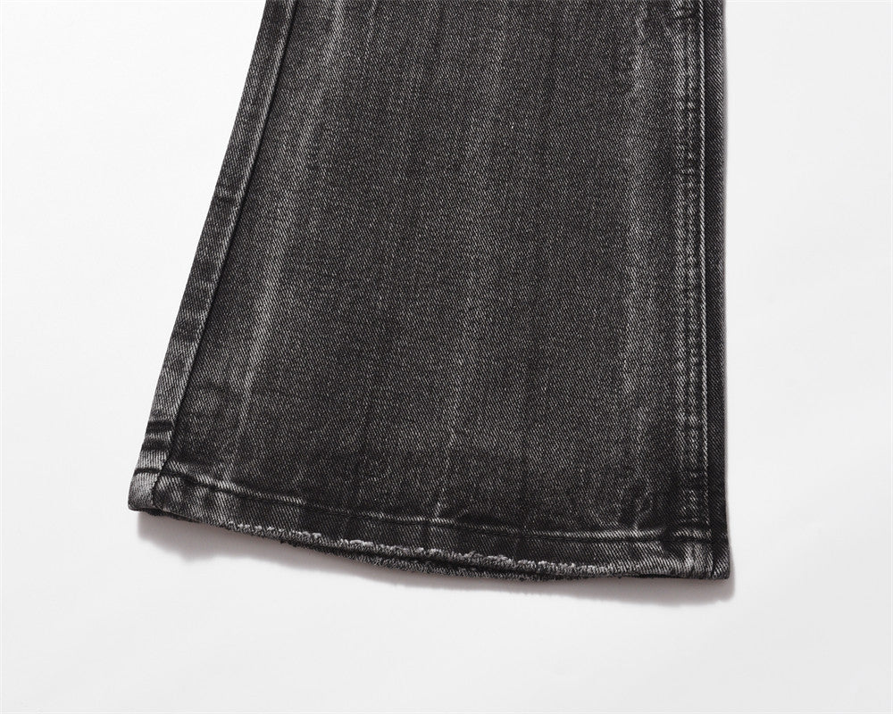 Close-up of MONO//FIT men's distressed wide-leg jeans showcasing the hem and fabric texture