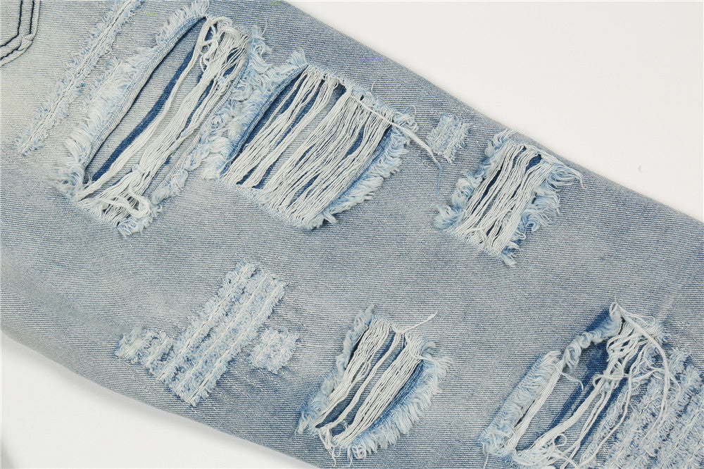 MONO//FIT men's flared jeans in light blue with distressed accent and frayed details