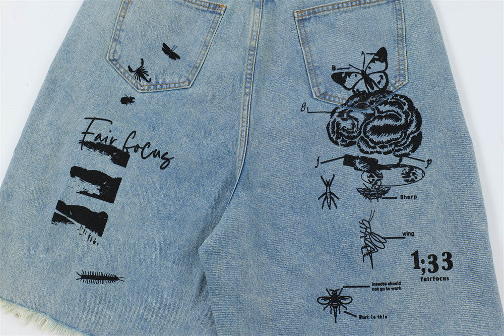 Men's printed denim shorts by MONO//FIT featuring unique graphic designs and a stylish look